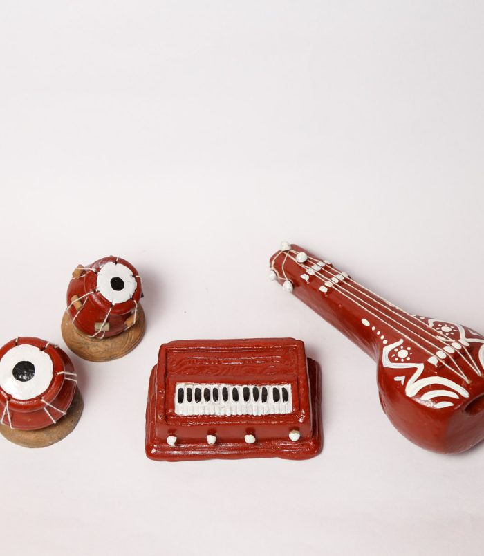 Miniature-Clay-Musical-Instruments-WhiteBG-TopView-RainbowFeathers.jpg