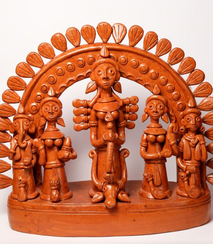 Terracotta-Devi-Durga-with-her-Children-in-Single-Frame-Ekchala-Durga-WhiteBG-RainbowFeathers.jpg