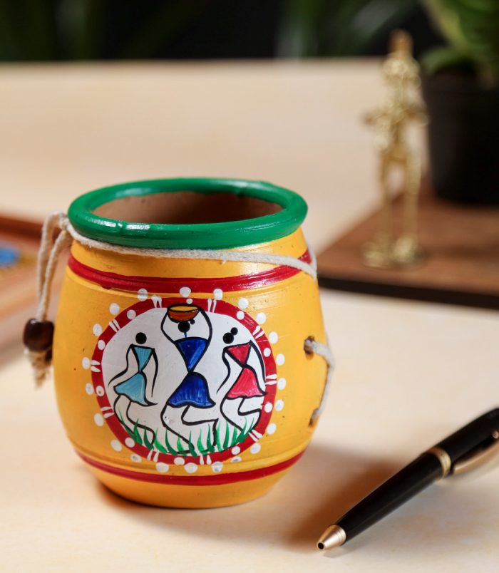 Warli-Hand-Painted-Terracotta-Yellow-Pen-Stand-RainbowFeathers.jpg Warli-Hand-Painted-Terracotta-Yellow-Pen-Stand-RainbowFeathers.jpg
